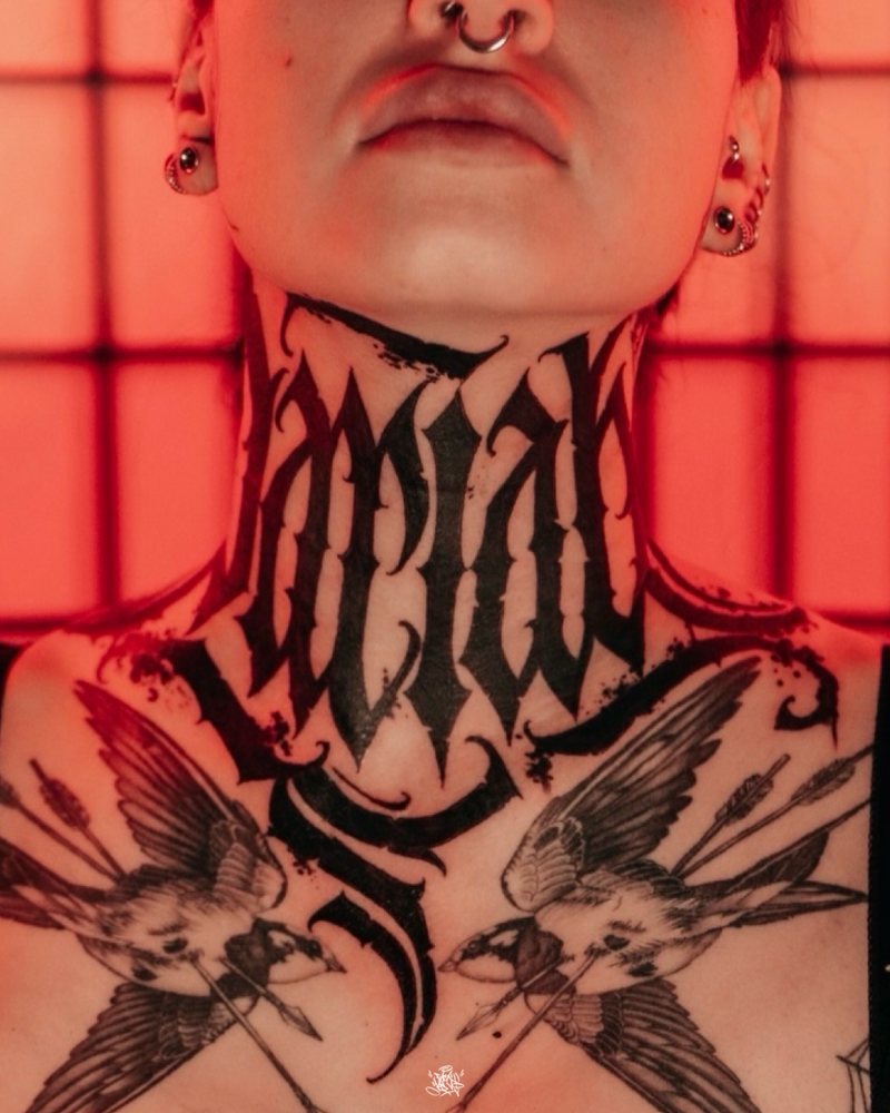 Lettering throat tattoo by Yas Vo