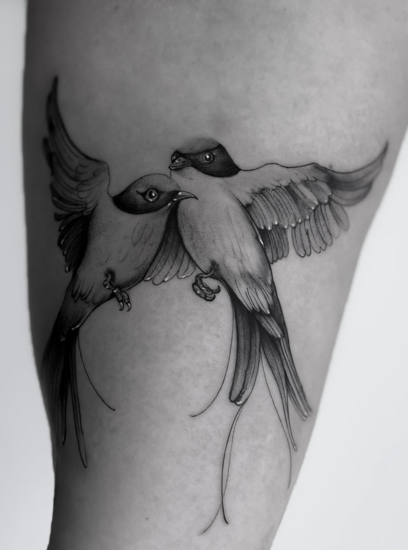 Fine line swallow tattoo by Inko