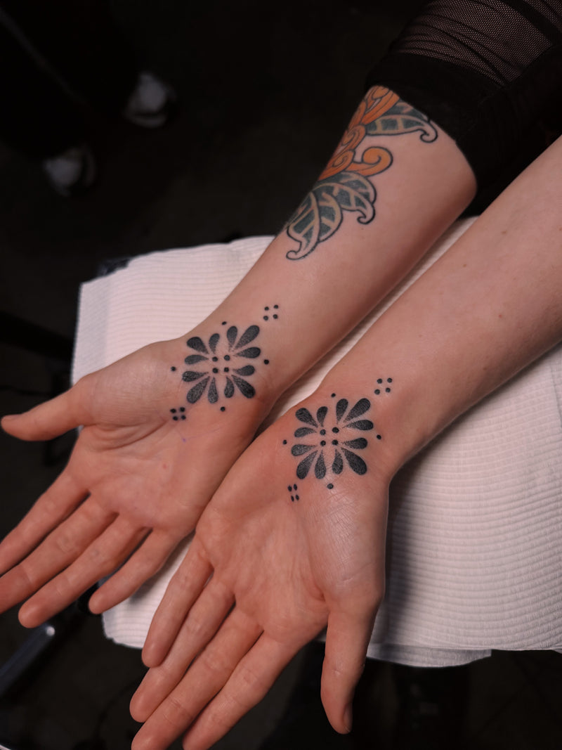 Handpoke ornamental hand tattoos by Georgia Mooney