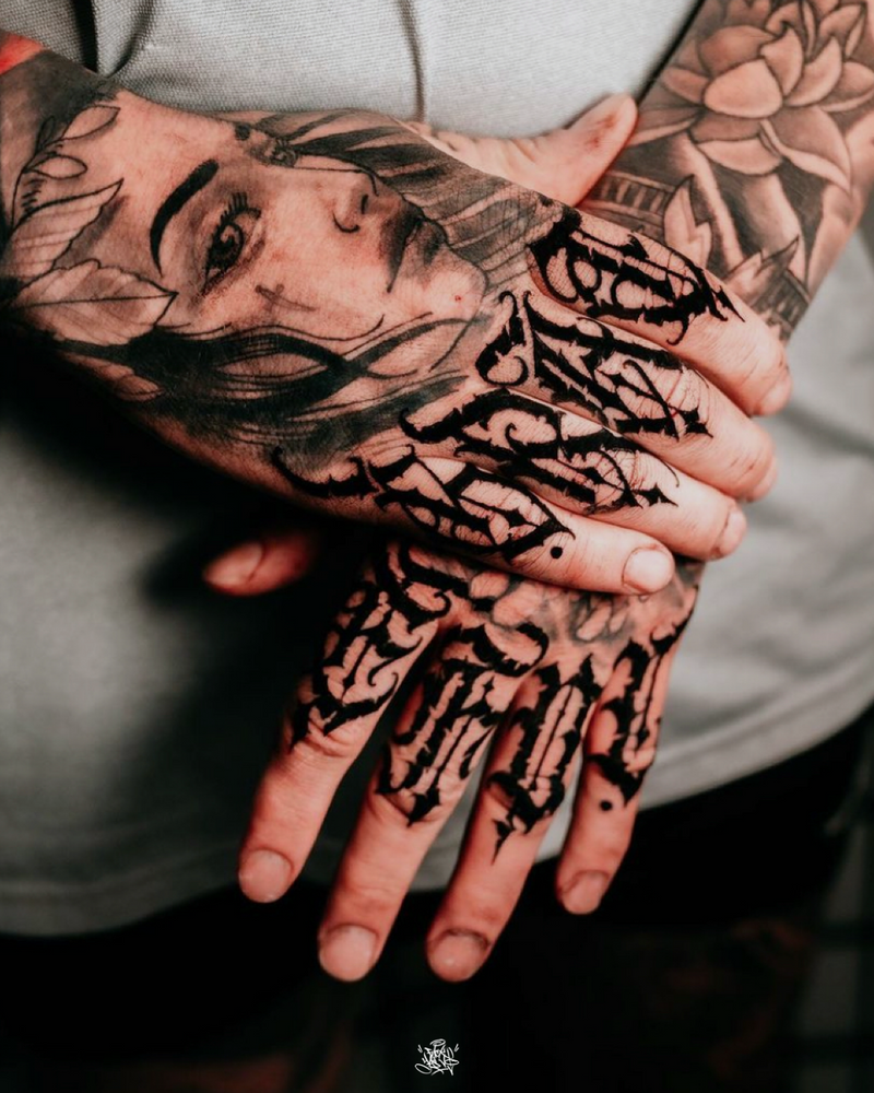 Script lettering hand tattoo by Yas Vo