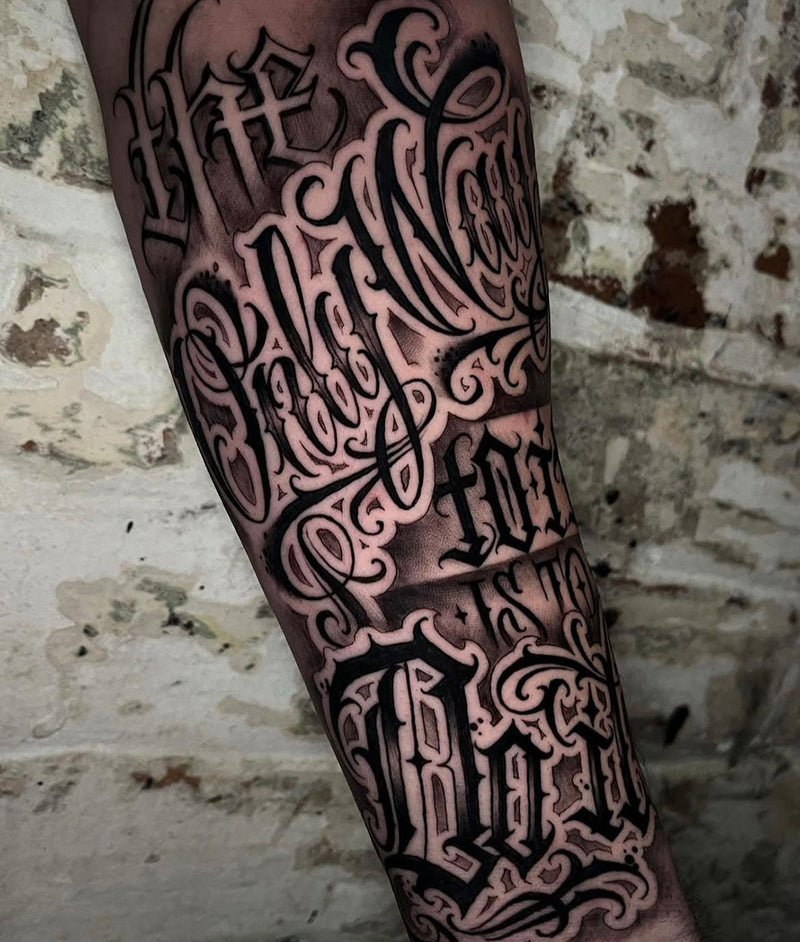 Script lettering forearm sleeve by Wade Lucas